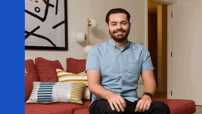Man sitting on a red sofa