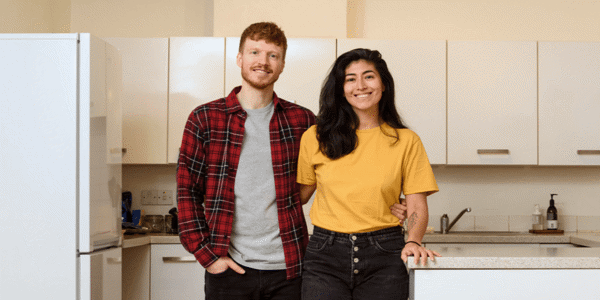 Man and woman standing in a kitchen