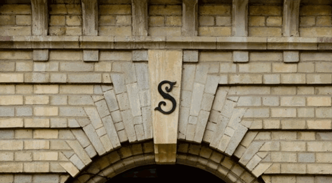 Closeup of a building with beige bricks