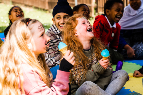 Girls laughing with ice cream