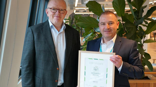 Two men smiling and holding a certificate