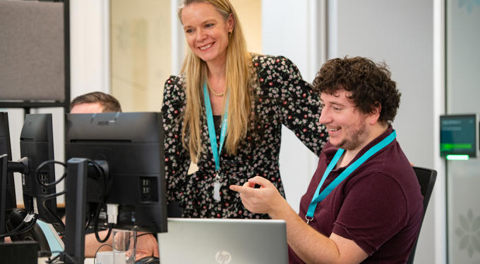 People looking at a computer screen